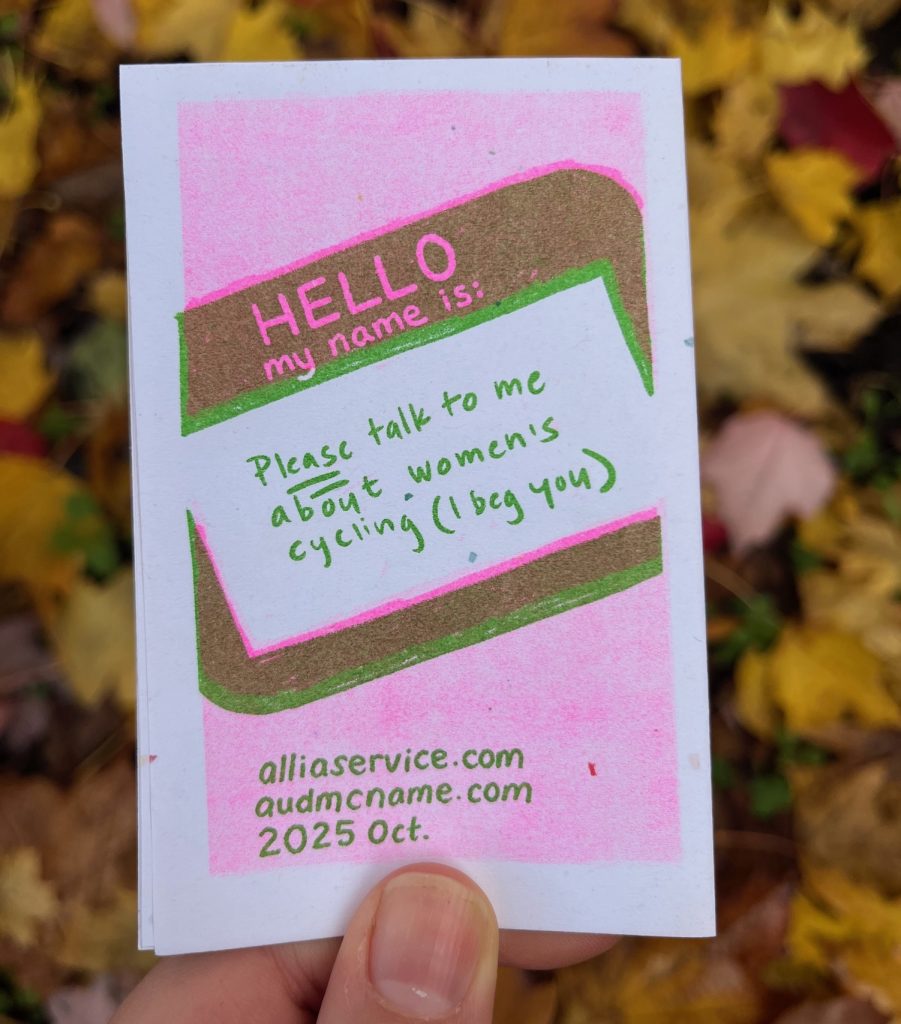 Back cover: a Hello my name is: name tag: "Please talk to me about women's cycling (I beg you). alliaservice.com, audmcname.com 2025 Oct.